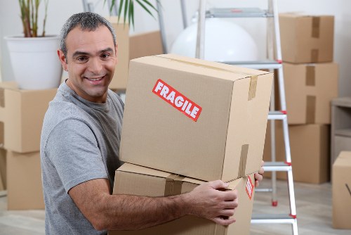 Staff securing furniture inside a moving van
