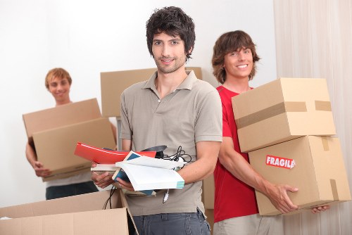Removal van and moving boxes representing local moving services in New Eltham