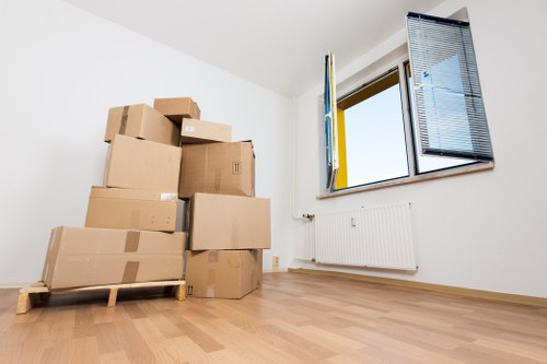 Prepared boxes and furniture ready for collection during a New Eltham removal