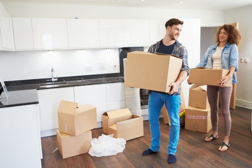 Packed office furniture ready for transport near New Eltham
