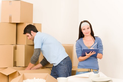 Local removals team handling furniture in a New Eltham home move